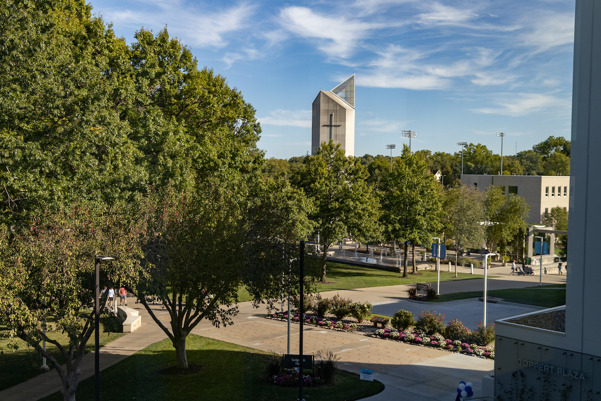 Aerial view of Rockhurst University campus with bell tower above the trees