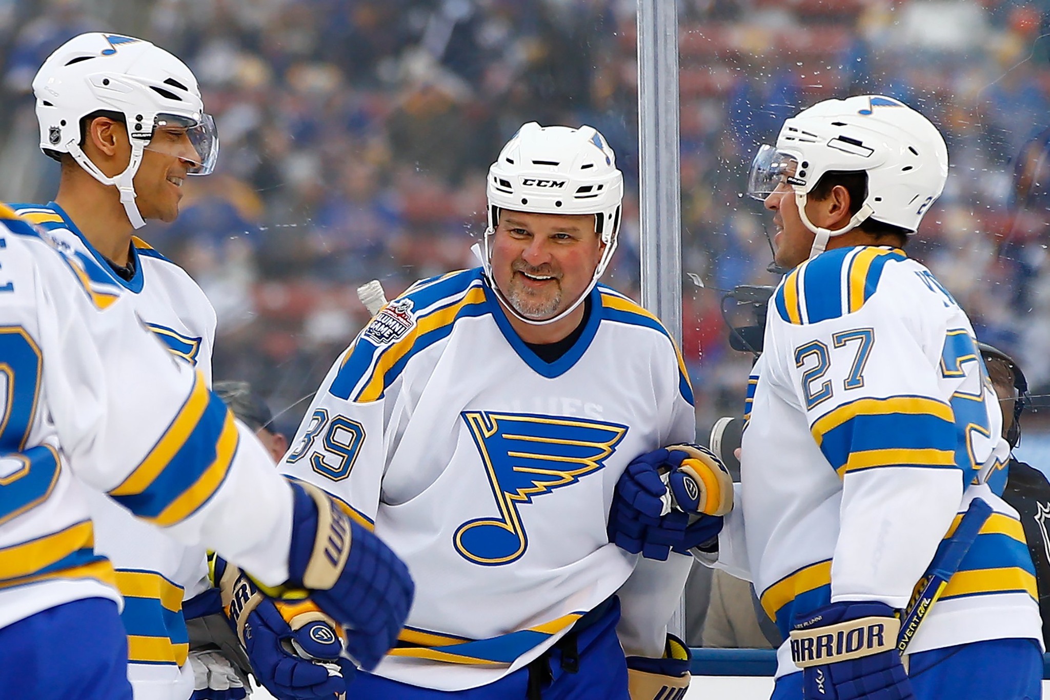 Kelly Chase and two teammates on the ice