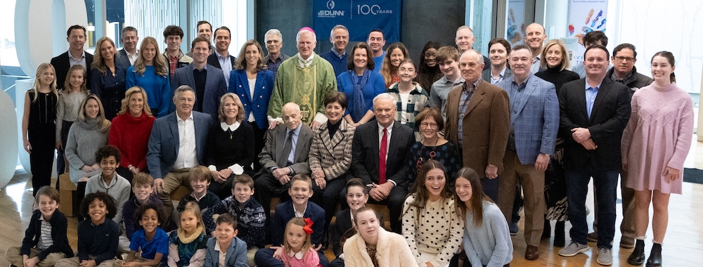 The Dunn family standing during a centennial celebration brunch