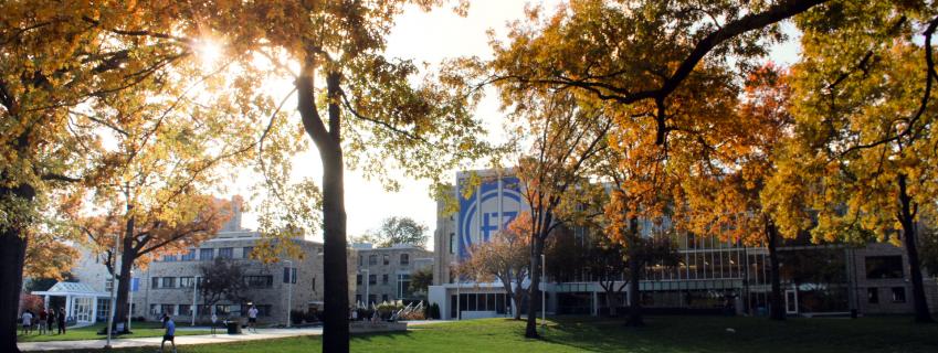 Autumn leaves in the foreground, Rockhurst University's Sedgwick Hall in the background