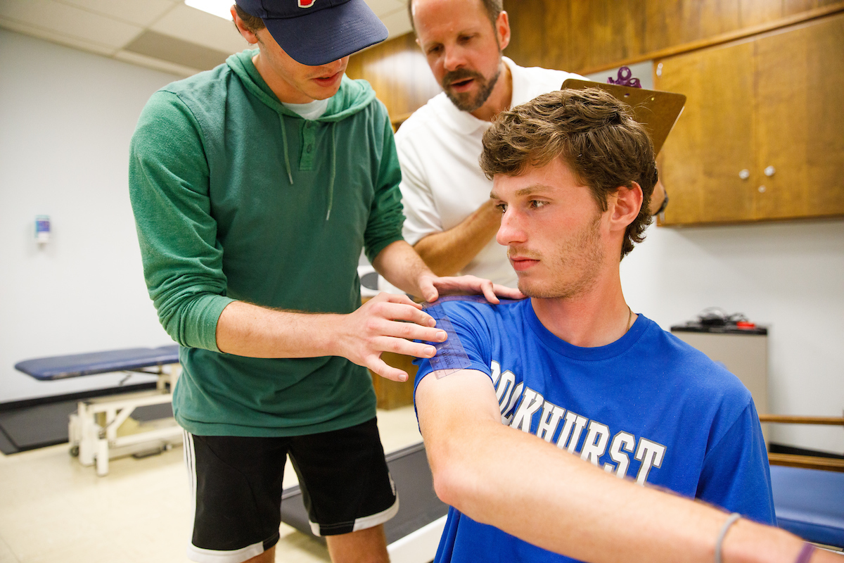 PT students work with an instructor