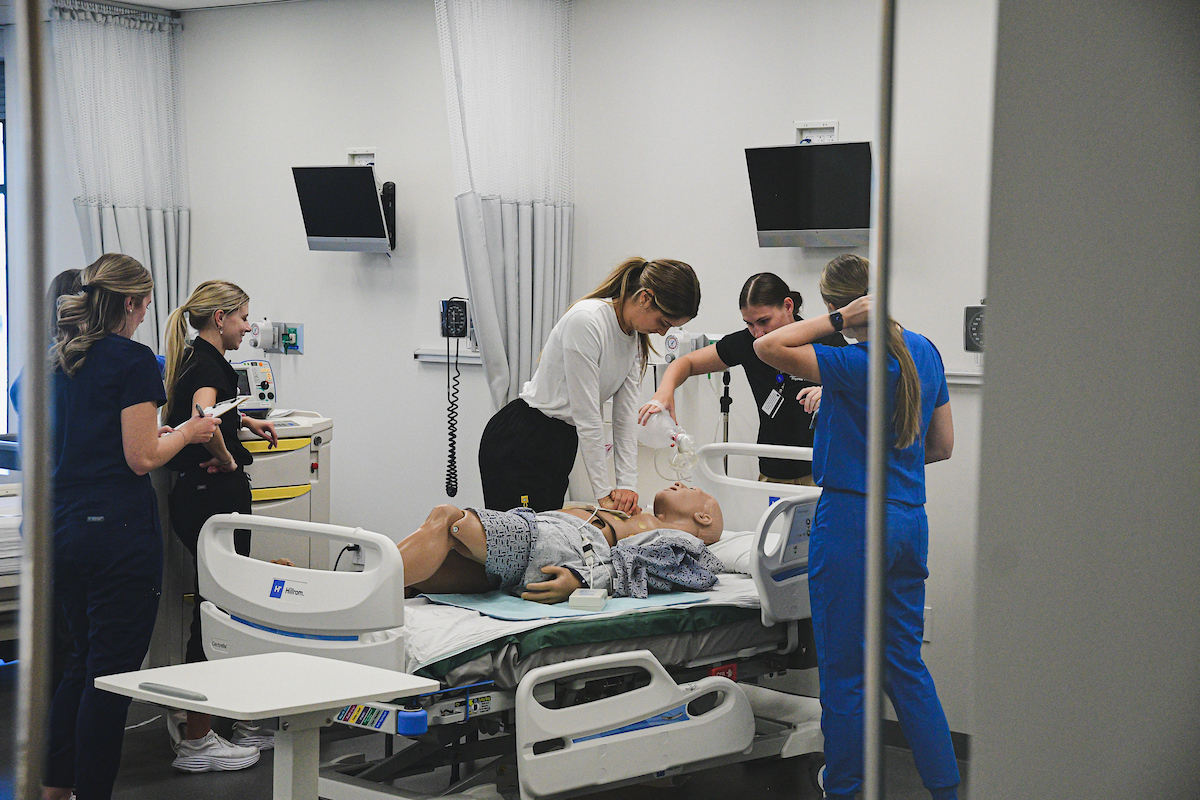 Nursing students perform CPR on a mannikin