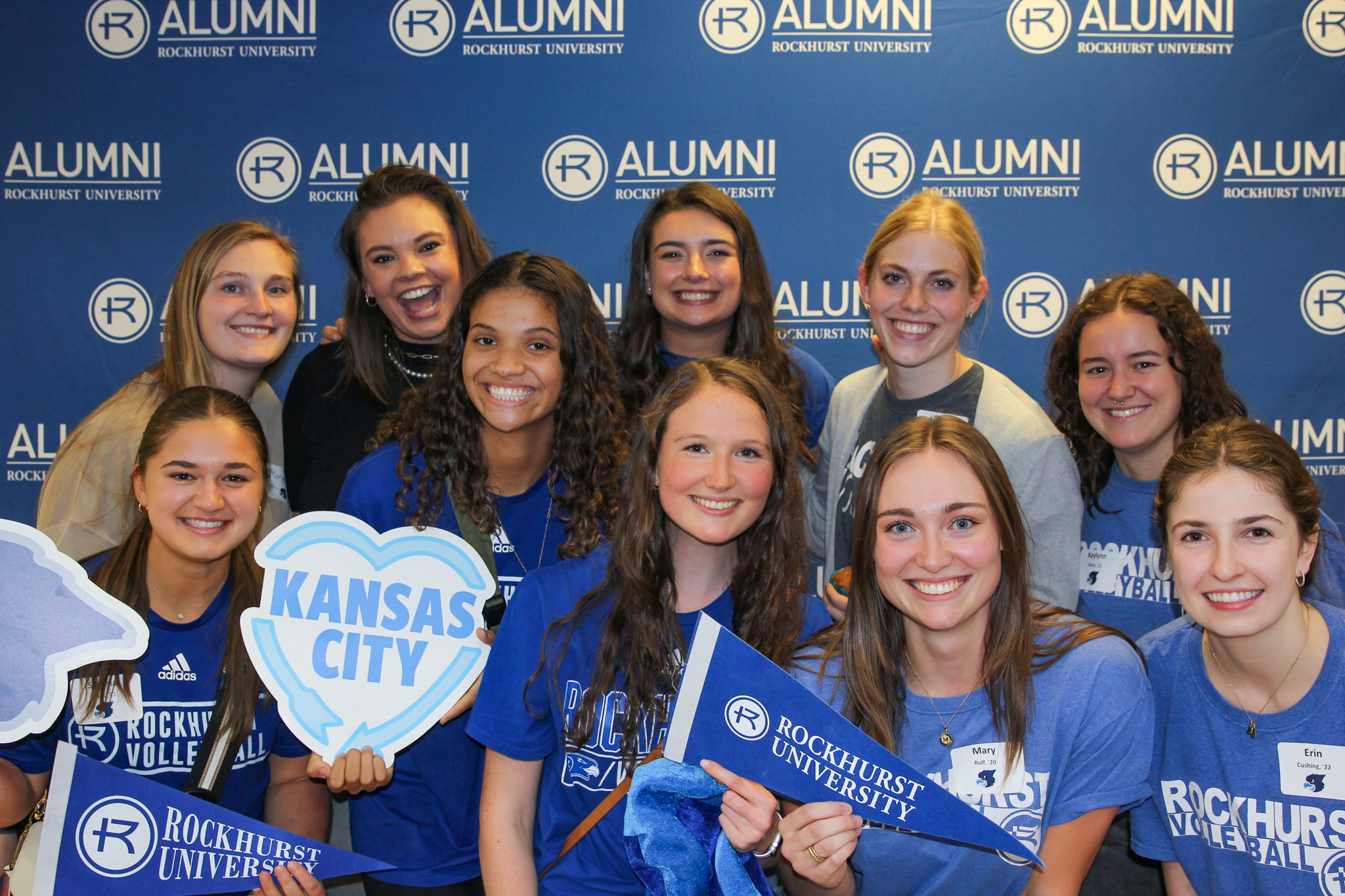 Rockhurst Students smiling and holiding KC and RU signs