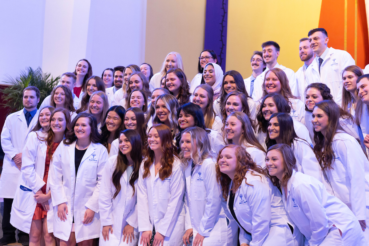 Physical Therapy graduates take a group photo after their white coat ceremony