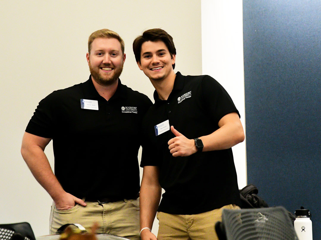 OT students Ryan and friend giving thumbs up