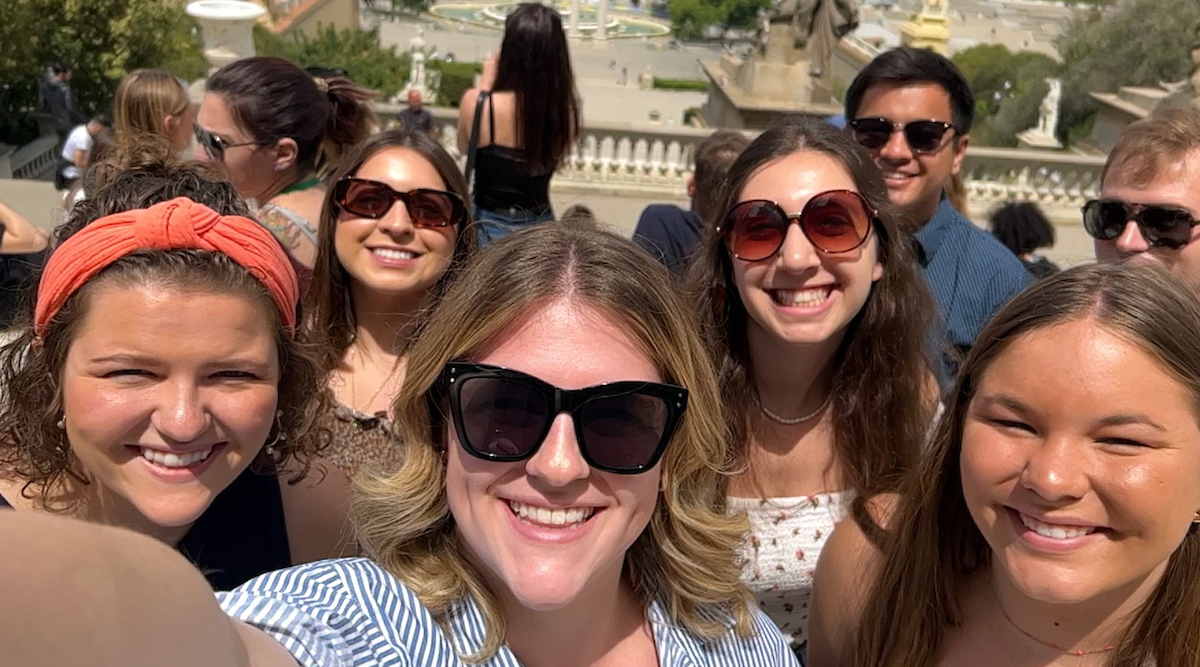 An Honors student takes a selfie of the group during a study abroad trip to Spain in 2023