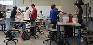 Students work with ceramics projects in Arrupe Hall