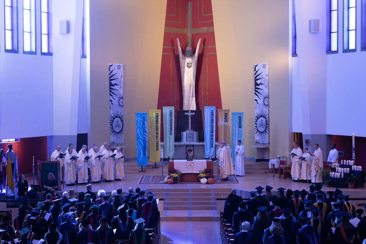 A service is underway at Saint Francis Xavier Church in Kansas City, as seen from the back of the sanctuary