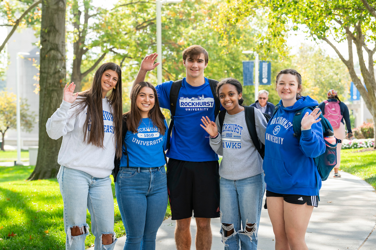 Group of students waiving