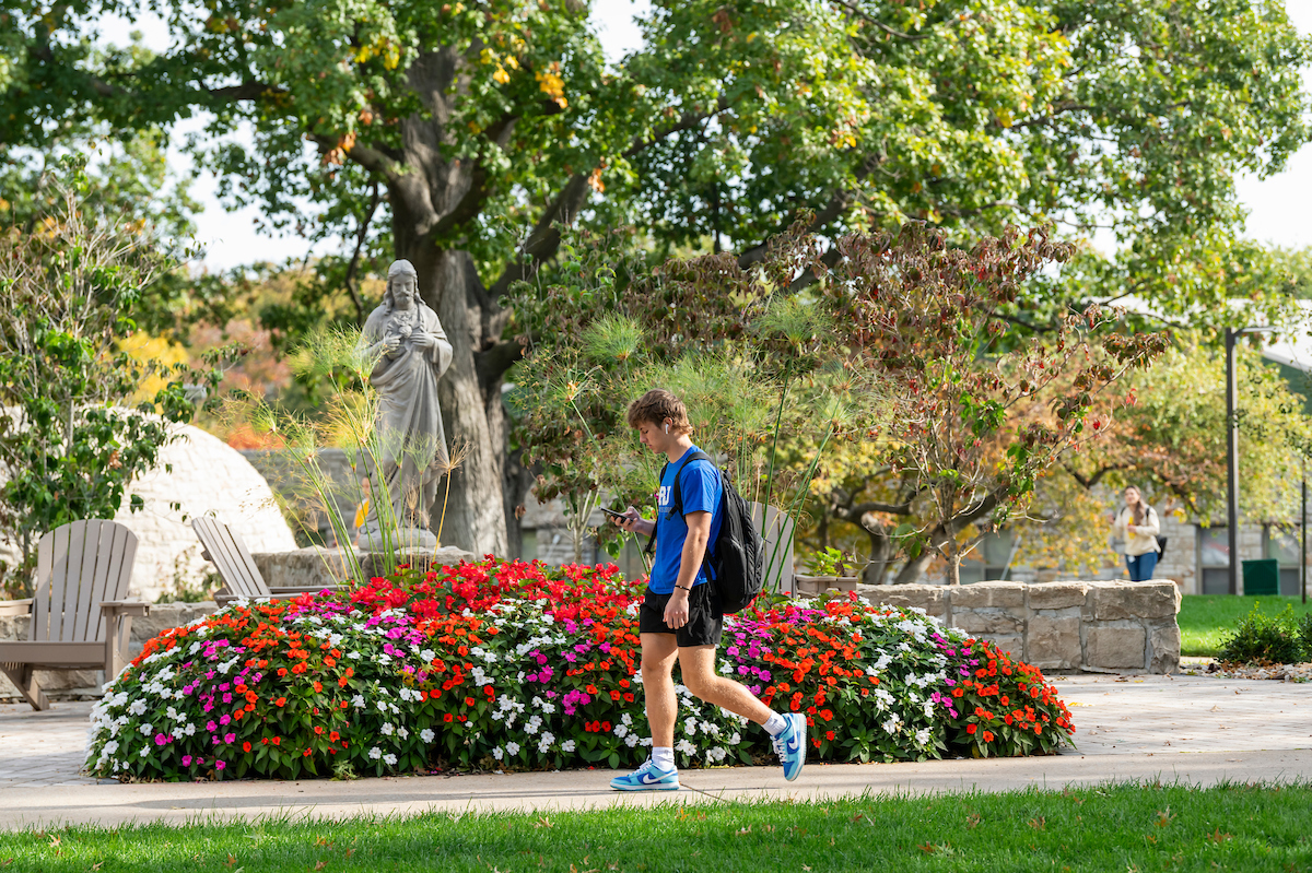 Male walking on campus