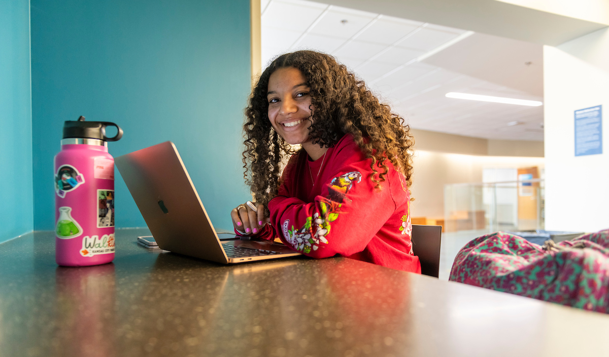 Student studying in Arrupe Hall