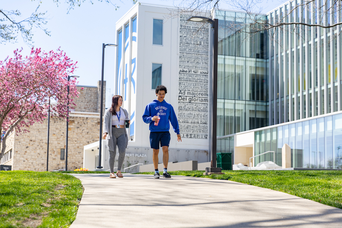 Two students walk in front of Sedgwick Hall