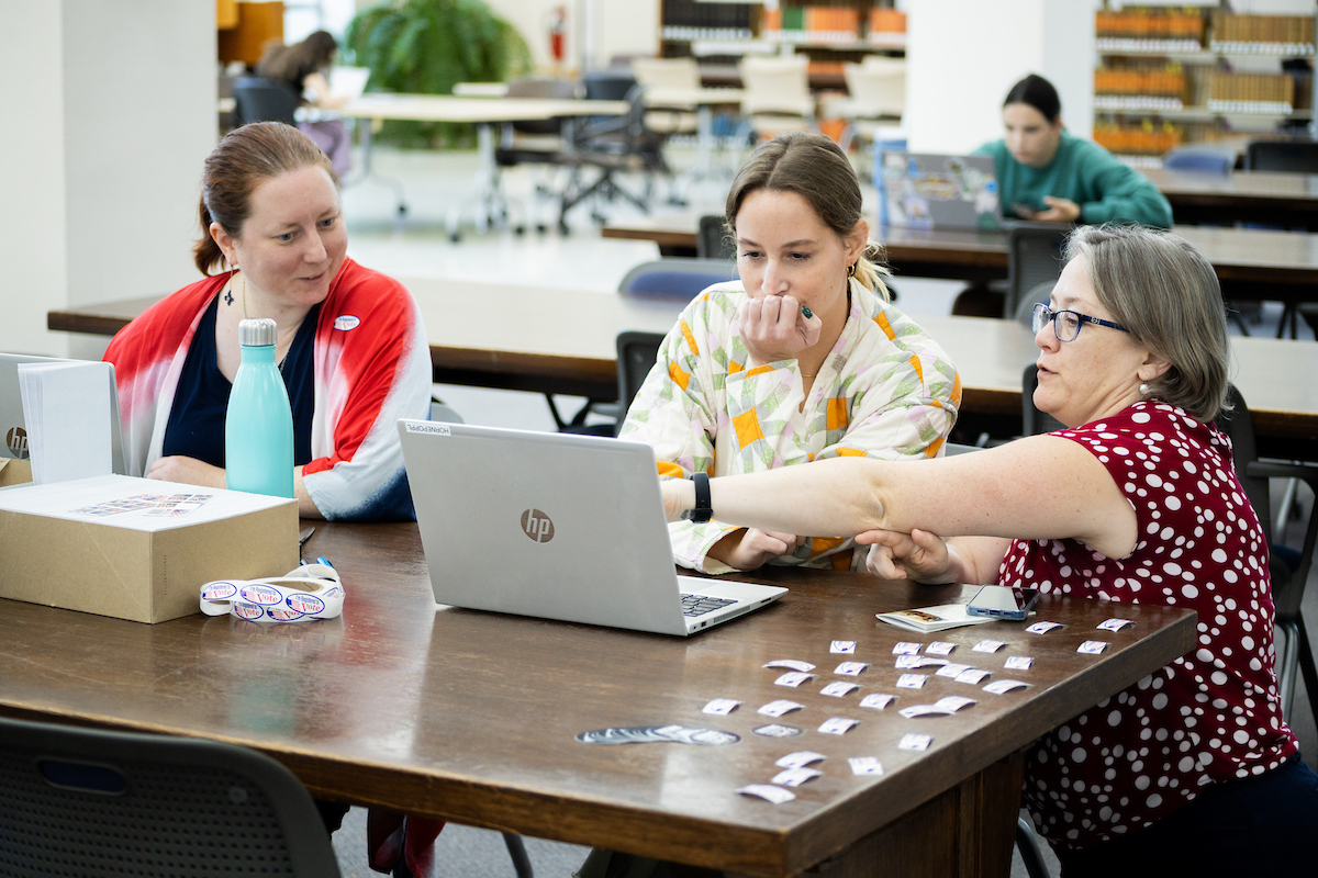 Laura Horne-Popp assists staff members with registering to vote