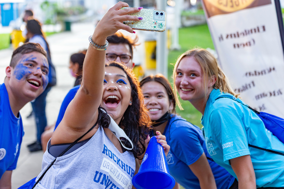 Group of smiling students taking a selfie