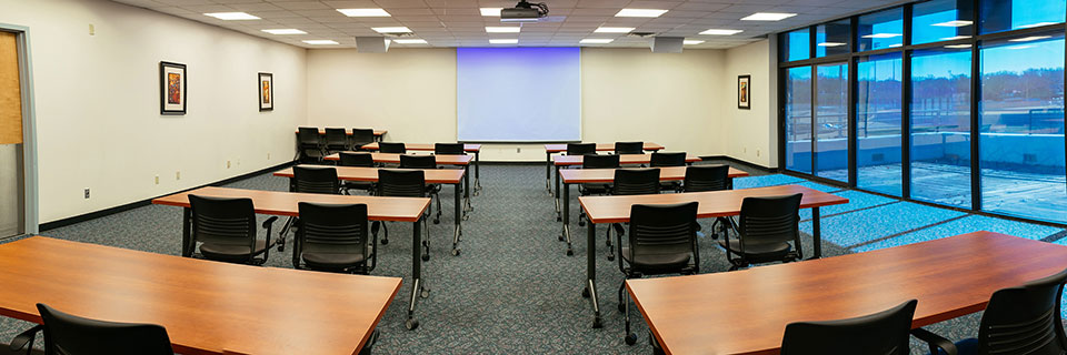 Massman 250 meeting room with window wall and 8 4-top tables