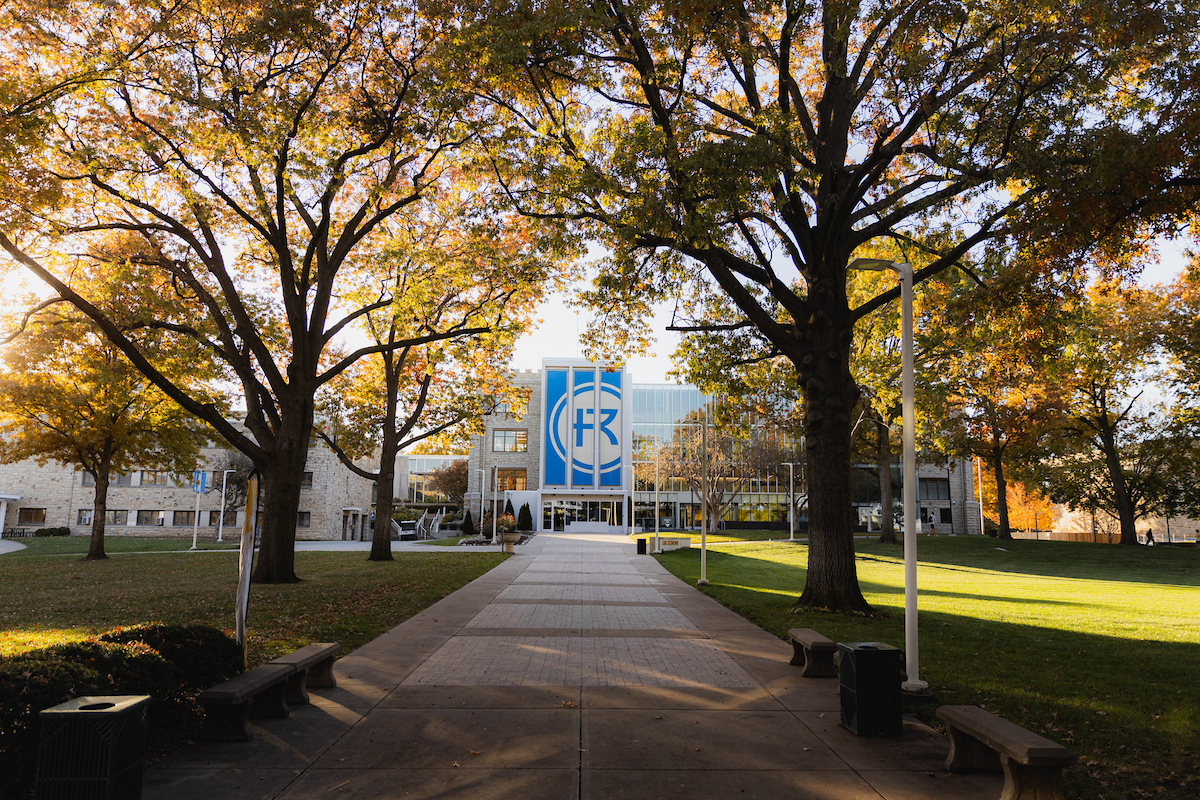 Sedgwick Hall viewed through the trees in the fall