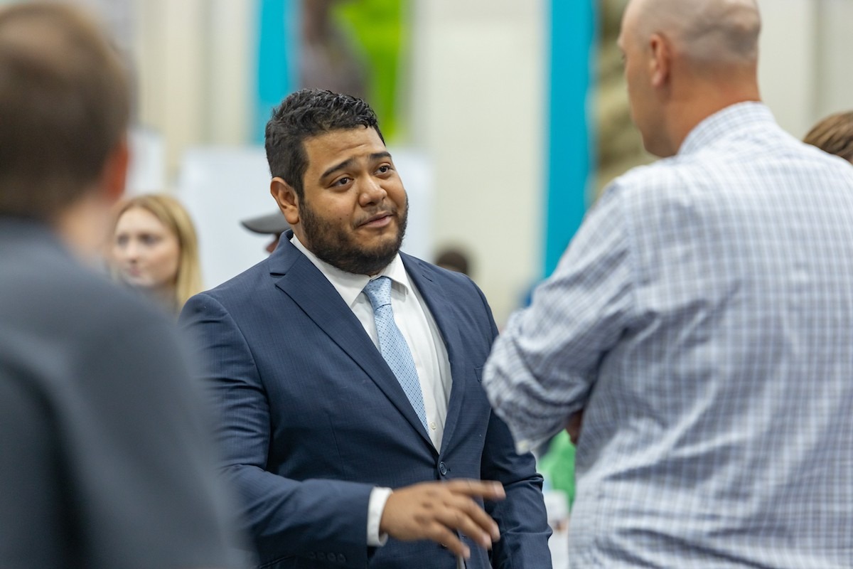 Student speaking with potential employer