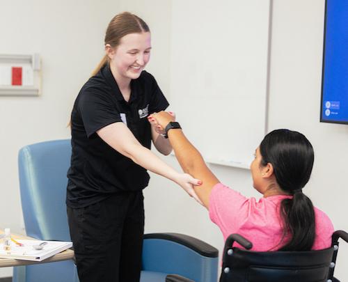 OTD student treating a patient