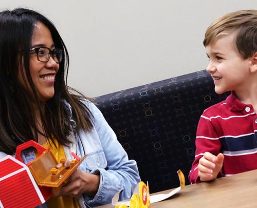 SLP Student working with child