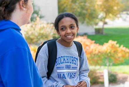 student smiling at friend