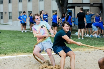 Two male Rockhurst students participating in tug-o-war