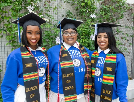 Three Black Student Union graduates pose for the camera
