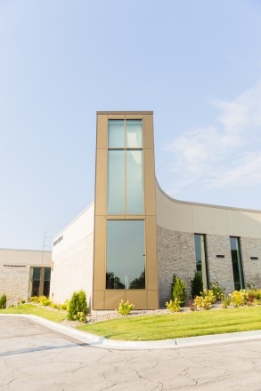 The large, vertical window of Mabee Chapel