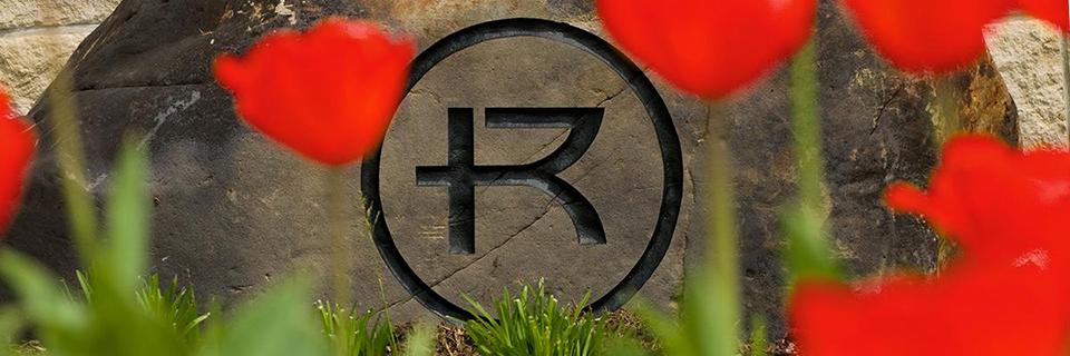Rockhurst logo flowers
