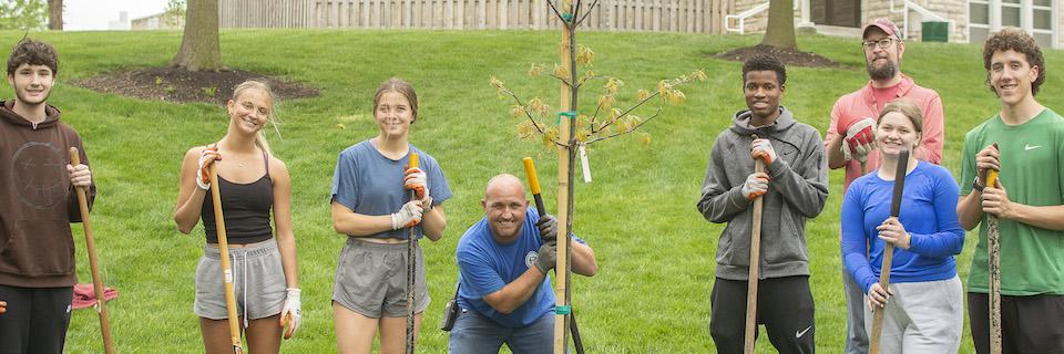 Students and staff after planting a tree on campsu