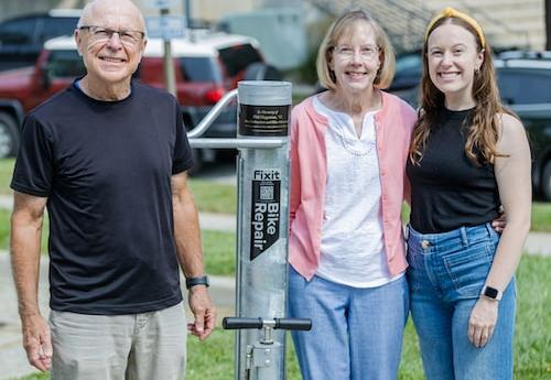 Members of the Hageman family in front of a new memorial on campus for their son